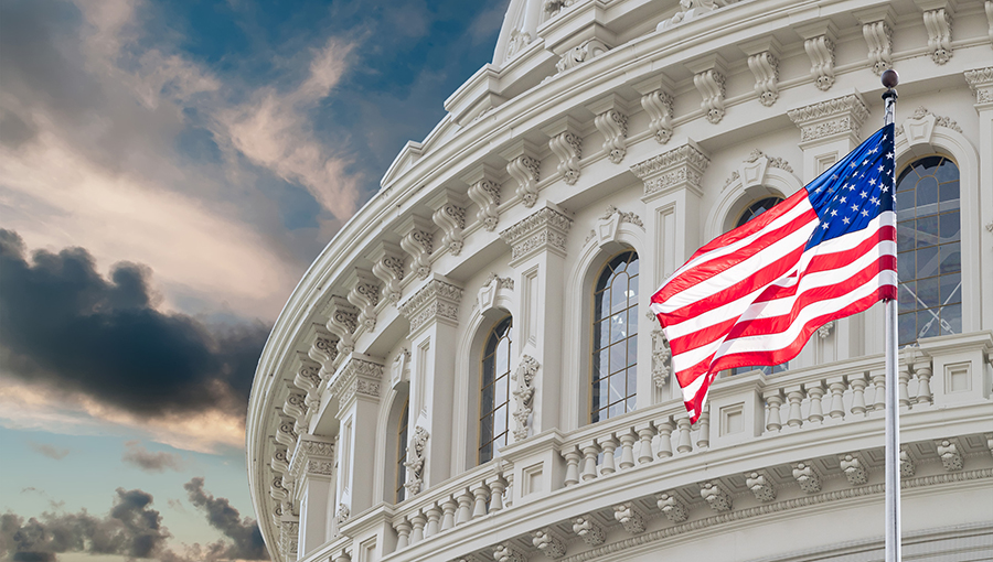 Washington DC Capitol dome detail with waving american flag