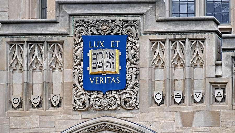NEW HAVEN, CT - JUNE 2015:  Yale University's seal dates from 1722 when Hebrew was part of a theological education.  It appears on many buildings on Yale's campus, as seen in New Haven in June 2015.