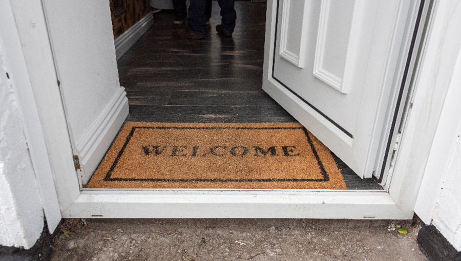 Welcome Mat positioned in an open doorway