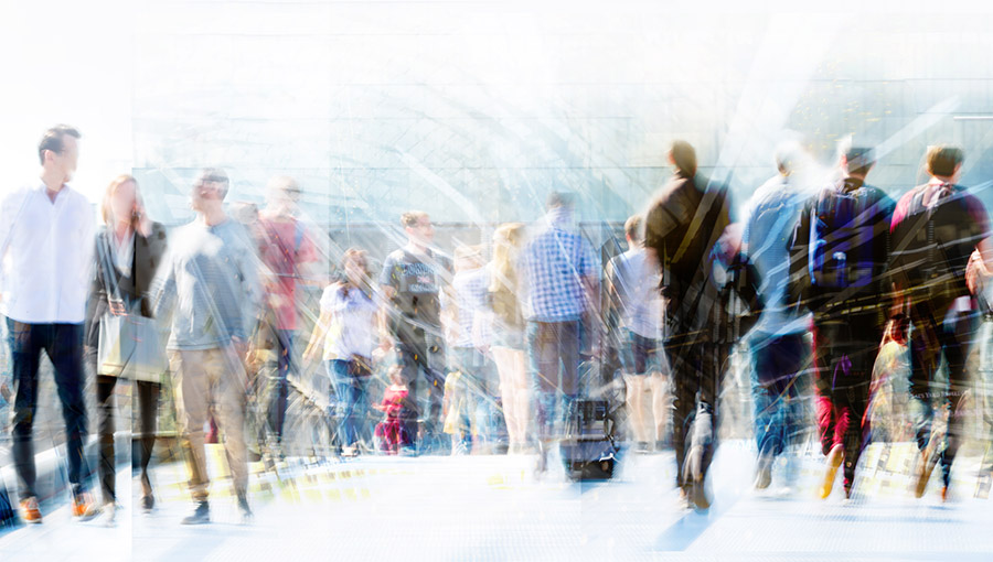 London, UK. Crowd of people walking at work in early morning. Concept wide background with  space for text. Multiple exposure image