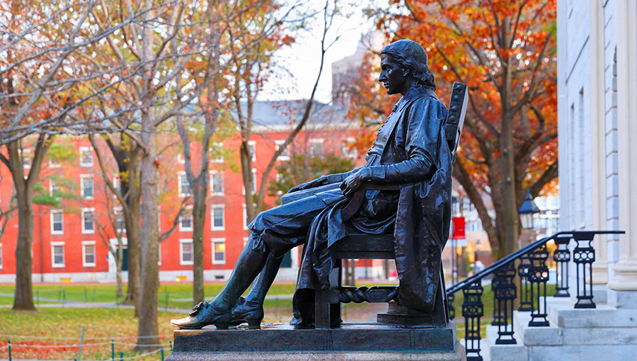 The Statue of John Harvard on the campus of Harvard University. The minister donated his library to the fledgling institution in the seventeenth century. 