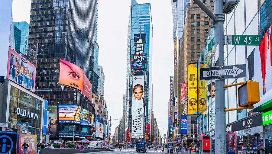 September 28, 2021. New York, Manhattan, New York, USA. Skyscrapers heading into the autumn sky with advertisements in Times Square in the morning